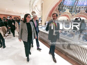 French Delegate Minister of Tourism Economy Marina Ferrari (3R), accompanied by Galeries Lafayette department store chairman Philippe Houze...