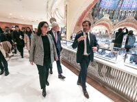 French Delegate Minister of Tourism Economy Marina Ferrari (3R), accompanied by Galeries Lafayette department store chairman Philippe Houze...