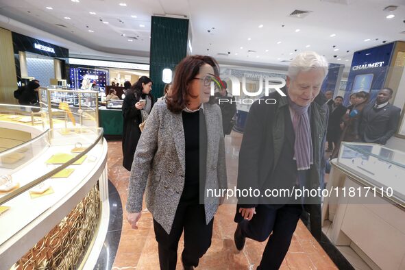 French Delegate Minister of Tourism Economy Marina Ferrari (center), accompanied by Galeries Lafayette department store chairman Philippe Ho...