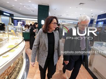 French Delegate Minister of Tourism Economy Marina Ferrari (center), accompanied by Galeries Lafayette department store chairman Philippe Ho...