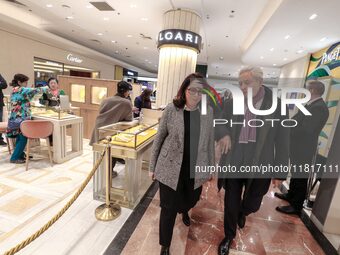 French Delegate Minister of Tourism Economy Marina Ferrari (center), accompanied by Galeries Lafayette department store chairman Philippe Ho...