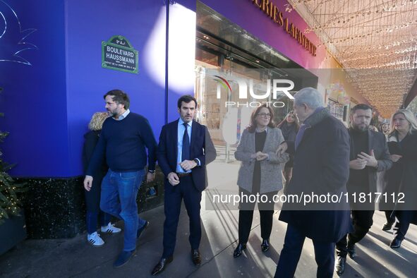 French Delegate Minister of Tourism Economy Marina Ferrari (center), accompanied by Galeries Lafayette department store chairman Philippe Ho...