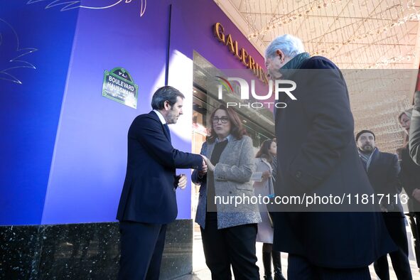 French Delegate Minister of Tourism Economy Marina Ferrari (center), accompanied by Galeries Lafayette department store chairman Philippe Ho...