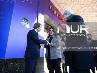 French Delegate Minister of Tourism Economy Marina Ferrari (center), accompanied by Galeries Lafayette department store chairman Philippe Ho...