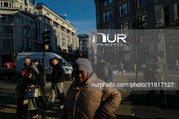 People walk in Oxford Circus, London, on November 28, 2024. 