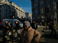 People walk in Oxford Circus, London, on November 28, 2024. (