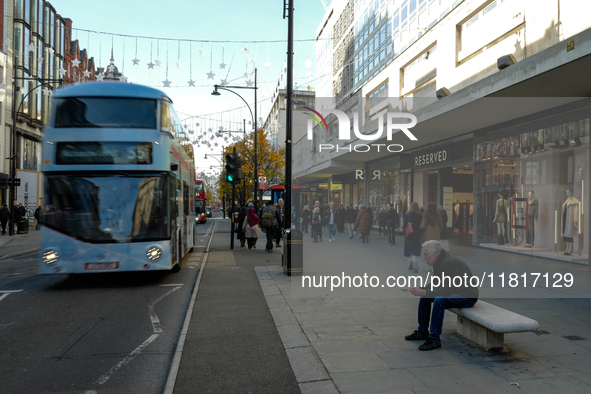 People walk on Oxford Street in London, United Kingdom, on November 28, 2024. 