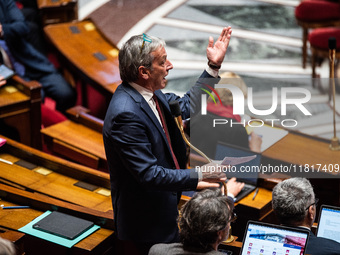 Democrat deputy Philippe Vigier is in Parliament during the debate on the repeal of the pension reform in Paris, France, on November 28, 202...