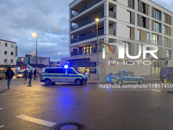 Police officers overpower a man on Bahnhofstrasse on November 28, 2024 (