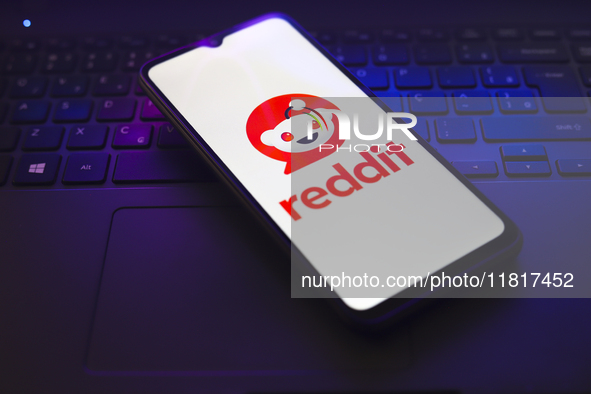 The Reddit logo appears on the screen of a smartphone that rests on top of a laptop keyboard in Reno, United States, on November 28, 2024. 