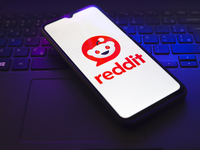 The Reddit logo appears on the screen of a smartphone that rests on top of a laptop keyboard in Reno, United States, on November 28, 2024. (