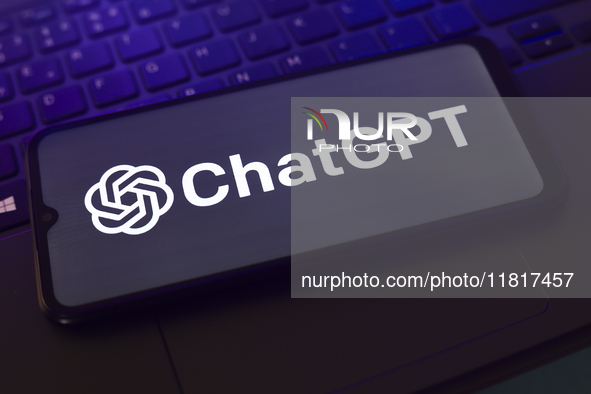 The ChatGPT logo appears on the screen of a smartphone that rests on top of the laptop keyboard in Reno, United States, on November 28, 2024...