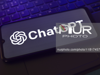 The ChatGPT logo appears on the screen of a smartphone that rests on top of the laptop keyboard in Reno, United States, on November 28, 2024...