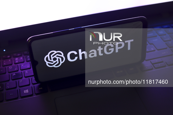 The ChatGPT logo appears on the screen of a smartphone that rests on top of the laptop keyboard in Reno, United States, on November 28, 2024...