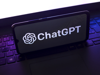 The ChatGPT logo appears on the screen of a smartphone that rests on top of the laptop keyboard in Reno, United States, on November 28, 2024...