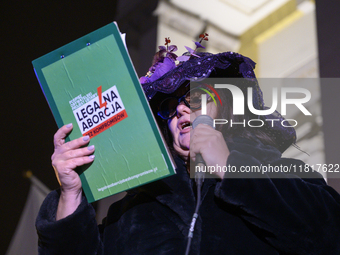 A woman dressed as a suffragette takes part in a rally in support of free and safe abortion in Warsaw, Poland, on November 28, 2024. A dozen...