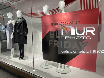 A sign for a Black Friday sale is in the window of a store at a shopping mall in Toronto, Ontario, Canada, on November 28, 2024 (