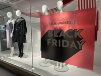 A sign for a Black Friday sale is in the window of a store at a shopping mall in Toronto, Ontario, Canada, on November 28, 2024 (