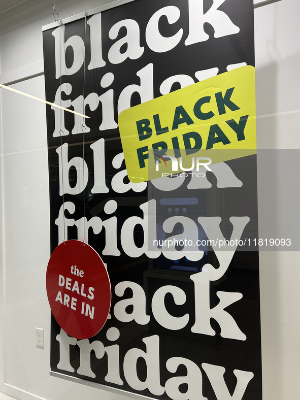 A sign for a Black Friday sale is in the window of a store at a shopping mall in Toronto, Ontario, Canada, on November 28, 2024 