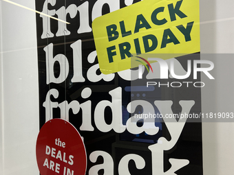 A sign for a Black Friday sale is in the window of a store at a shopping mall in Toronto, Ontario, Canada, on November 28, 2024 (