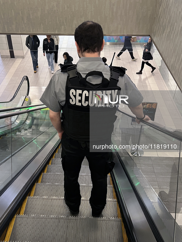 A security guard patrols a shopping mall in Toronto, Ontario, Canada, on November 28, 2024. 