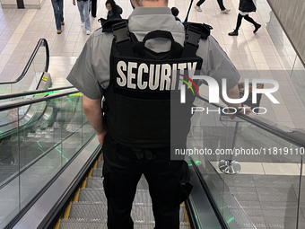 A security guard patrols a shopping mall in Toronto, Ontario, Canada, on November 28, 2024. (