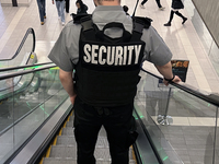 A security guard patrols a shopping mall in Toronto, Ontario, Canada, on November 28, 2024. (