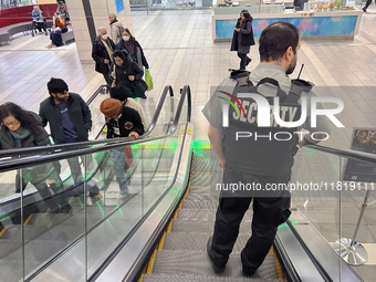 A security guard patrols a shopping mall in Toronto, Ontario, Canada, on November 28, 2024. (