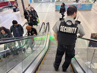 A security guard patrols a shopping mall in Toronto, Ontario, Canada, on November 28, 2024. (