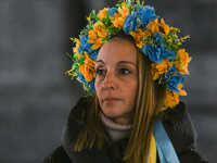 KRAKOW, POLAND - NOVEMBER 28:
A protester wearing a wreath in Ukrainian colors on the evening of the 1009th day of Russia's invasion of Ukra...