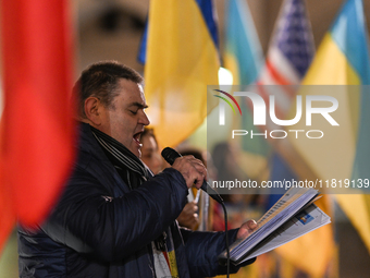 KRAKOW, POLAND - NOVEMBER 28:
Frenchman Henri Deluy joins members of the Ukrainian diaspora on the evening of the 1009th day of Russia's inv...