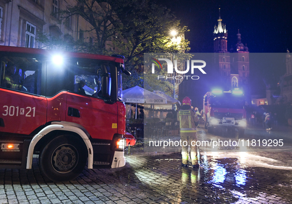 KRAKOW, POLAND - NOVEMBER 28:   
Two fire brigade vehicles are seen at Krakow's UNESCO Main Square after a gas cylinder caught fire in a res...