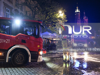 KRAKOW, POLAND - NOVEMBER 28:   
Two fire brigade vehicles are seen at Krakow's UNESCO Main Square after a gas cylinder caught fire in a res...