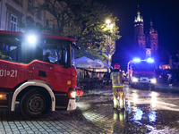 KRAKOW, POLAND - NOVEMBER 28:   
Two fire brigade vehicles are seen at Krakow's UNESCO Main Square after a gas cylinder caught fire in a res...