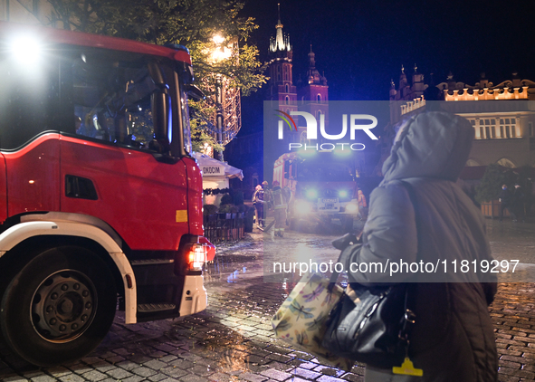 KRAKOW, POLAND - NOVEMBER 28:   
Two fire brigade vehicles are seen at at the scene at Krakow's UNESCO Main Square after a gas cylinder caug...