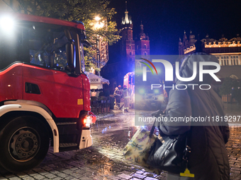 KRAKOW, POLAND - NOVEMBER 28:   
Two fire brigade vehicles are seen at at the scene at Krakow's UNESCO Main Square after a gas cylinder caug...