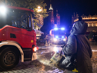 KRAKOW, POLAND - NOVEMBER 28:   
Two fire brigade vehicles are seen at at the scene at Krakow's UNESCO Main Square after a gas cylinder caug...