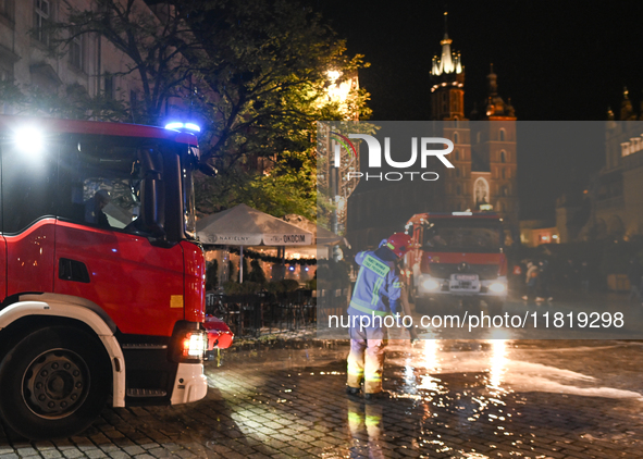 KRAKOW, POLAND - NOVEMBER 28:   
Two fire brigade vehicles are seen at at the scene at Krakow's UNESCO Main Square after a gas cylinder caug...