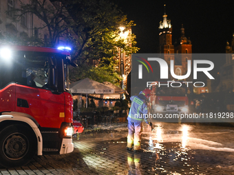 KRAKOW, POLAND - NOVEMBER 28:   
Two fire brigade vehicles are seen at at the scene at Krakow's UNESCO Main Square after a gas cylinder caug...