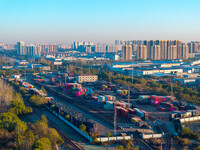 Containers wait to be loaded and unloaded at the terminal of Huaian Port Logistics Group in Huai'an, Jiangsu province, China, on November 29...