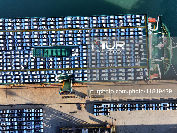 A large number of vehicles are ready to be shipped for export at the port of Lianyungang in Jiangsu province, China, on November 29, 2024. 