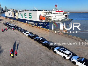 A large number of vehicles are ready to be shipped for export at the port of Lianyungang in Jiangsu province, China, on November 29, 2024. (