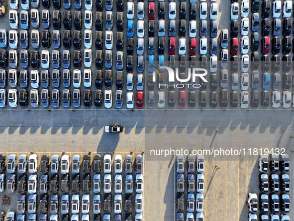 A large number of vehicles are ready to be shipped for export at the port of Lianyungang in Jiangsu province, China, on November 29, 2024. 