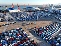 A large number of vehicles are ready to be shipped for export at the port of Lianyungang in Jiangsu province, China, on November 29, 2024. (