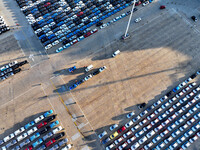 A large number of vehicles are ready to be shipped for export at the port of Lianyungang in Jiangsu province, China, on November 29, 2024. (