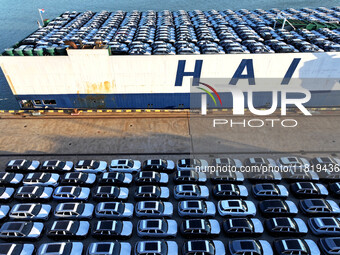 A large number of vehicles are ready to be shipped for export at the port of Lianyungang in Jiangsu province, China, on November 29, 2024. (