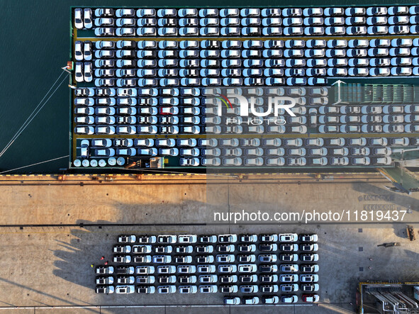 A large number of vehicles are ready to be shipped for export at the port of Lianyungang in Jiangsu province, China, on November 29, 2024. 