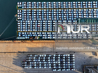 A large number of vehicles are ready to be shipped for export at the port of Lianyungang in Jiangsu province, China, on November 29, 2024. (