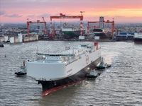 The car carrier ''BYD Changzhou'' departs with the assistance of a tugboat at CIMC Raffles' Shandong Longkou construction base in Yantai, Ch...