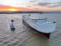 The car carrier ''BYD Changzhou'' departs with the assistance of a tugboat at CIMC Raffles' Shandong Longkou construction base in Yantai, Ch...